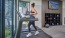 Two women running on treadmills