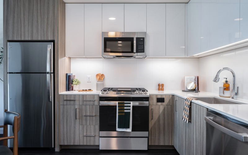 Dual-toned cabinetry with sleek stainless steel appliances