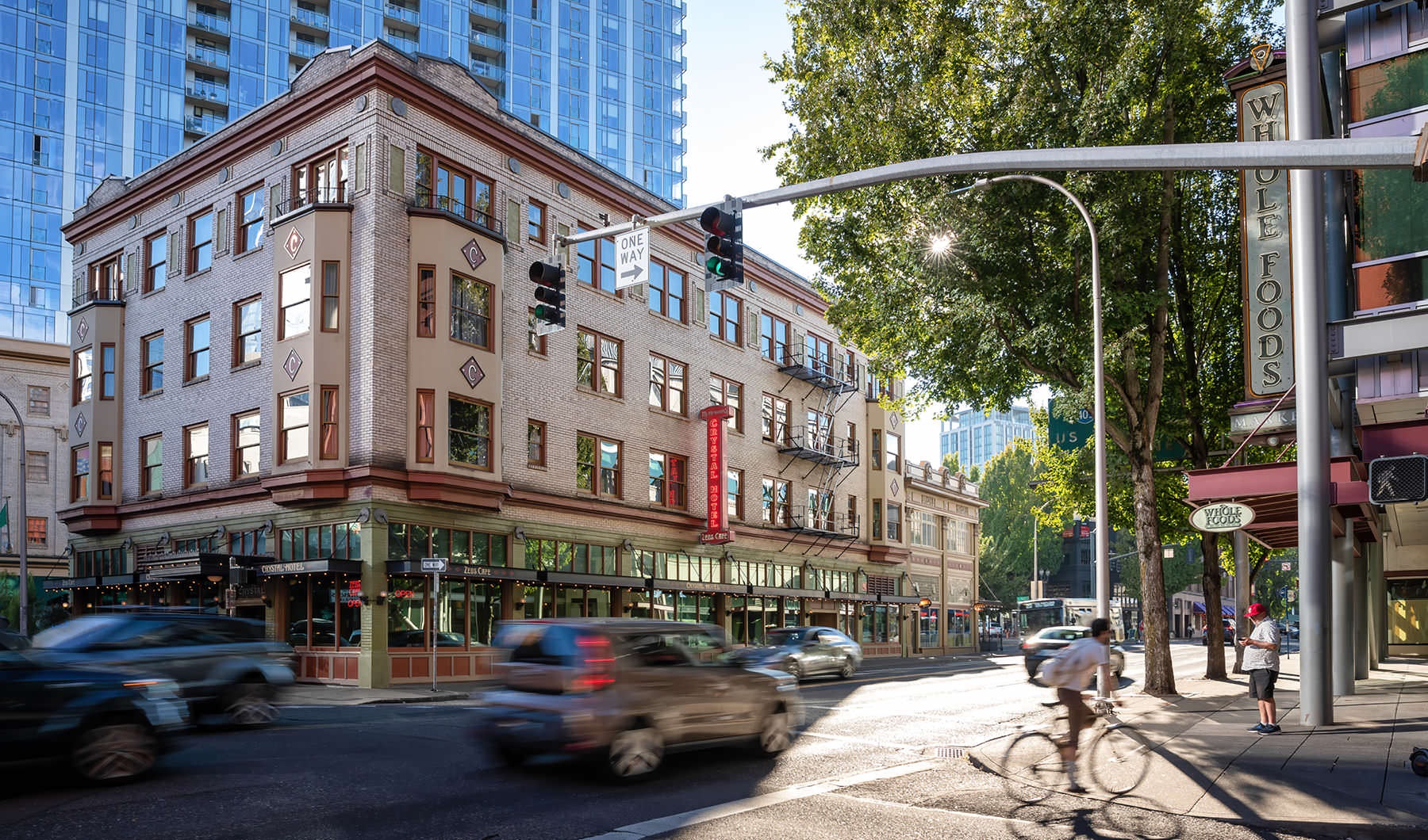 Your Gateway to The Pearl bicyclist and cars on neighborhood streets