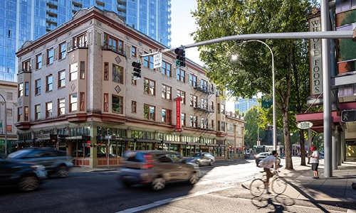 bicyclist and cars on neighborhood streets